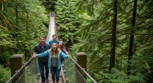 A family enjoying Vancouver sightseeing pass discounts at the Capilano Suspension Bridge.