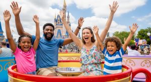 A happy family enjoying a ride, illustrating the fun made possible with the best theme park passes for families.