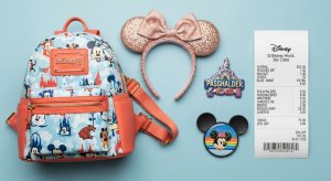 A display of merchandise showing the savings available with a Disney World annual pass.