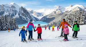 Family skiing beginner terrain at Lake Louise Ski Resort with Lake Louise and Fairview Mountain in background